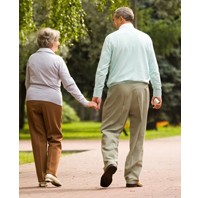 Photo of older couple walking